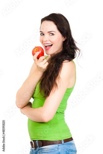 Photo: Young healthy woman eating apple Young healthy woman eating apple