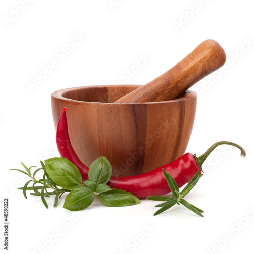 Photo: fresh flavoring herbs and spices in wooden mortar fresh flavoring herbs and spices in wooden mortar
