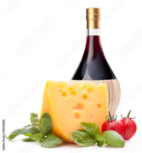 Photo: Red wine bottle, cheese and tomato still life Red wine bottle, cheese and tomato still life