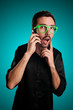 doubtful man holding phone