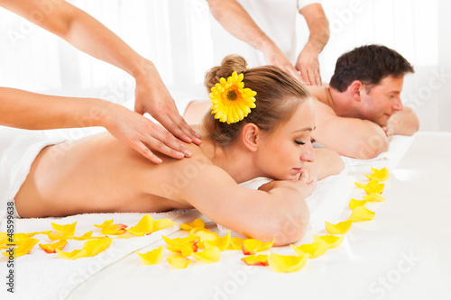 Photo: Attractive couple having a massage Attractive couple having a massage