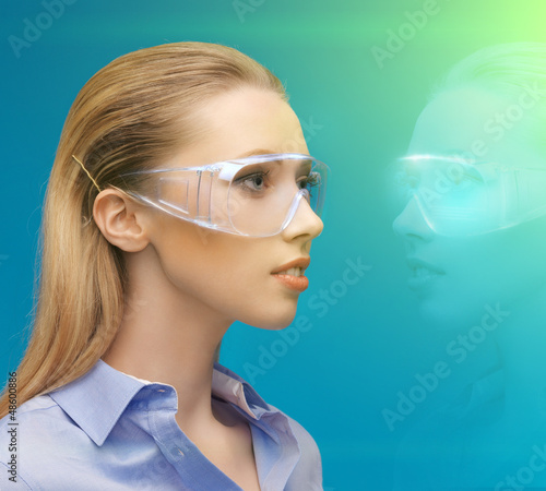 Photo: woman in 3d glasses with hologram woman in 3d glasses with hologram