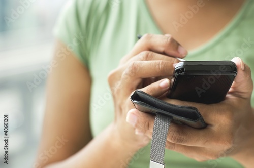 Photo: woman using smartphone woman using smartphone