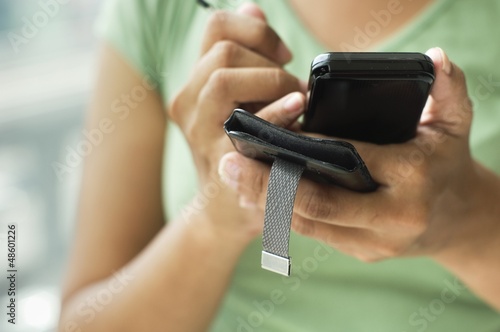 Photo: woman using smartphone woman using smartphone