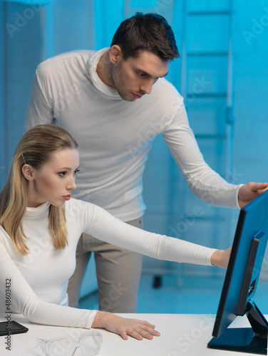 Photo: man and woman in laboratory man and woman in laboratory