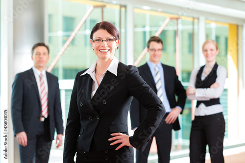 Photo: Business - group of businesspeople in office Business - group of businesspeople in office