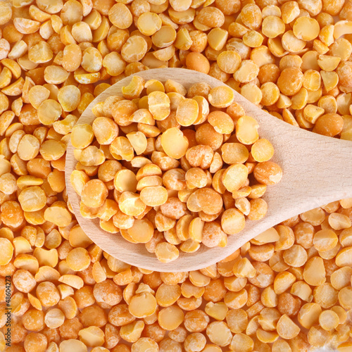 Photo: Dry peas in wooden spoon Dry peas in wooden spoon