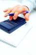 Closeup of a businessman calculating
