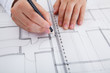 Architect working on blueprints