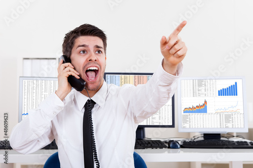 Photo: Stock broker in a bull market Stock broker in a bull market
