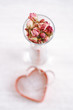 rose tea buds in glass