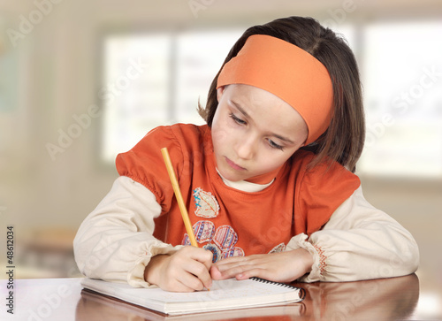 Photo: Adorable girl studying Adorable girl studying