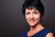 pretty middle aged woman closeup portrait on black