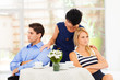 caring mother reconciling fighting young couple