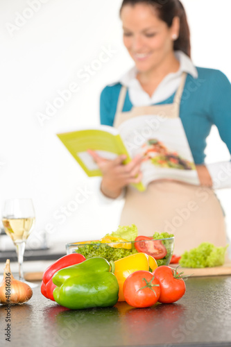 Photo: Happy woman preparing recipe vegetables cooking kitchen Happy woman preparing recipe vegetables cooking kitchen