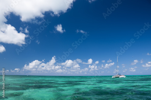 Photo: White catamaran with tourists White catamaran with tourists