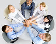 Business team making pile of hands on working place