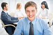 Happy business man with colleagues