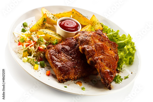 Photo: Tasty grilled ribs with vegetables Tasty grilled ribs with vegetables