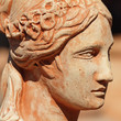 detail of classic clay sculpture with female face profile, Tusca