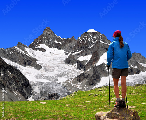 Photo: girl looking at the Mount Gabelhorn in the Swiss Alps girl looking at the Mount Gabelhorn in the Swiss Alps