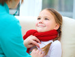 Photo: Doctor is examining little girl using stethoscope Doctor is examining little girl using stethoscope