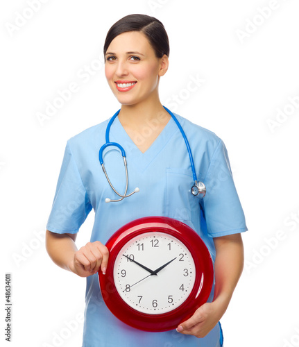 Photo: Young doctor with clock Young doctor with clock