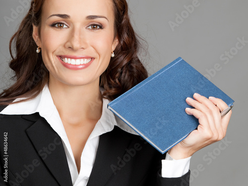 Photo: Businesswoman with notepad or organizer Businesswoman with notepad or organizer