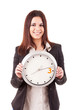 Businesswoman holding a clock