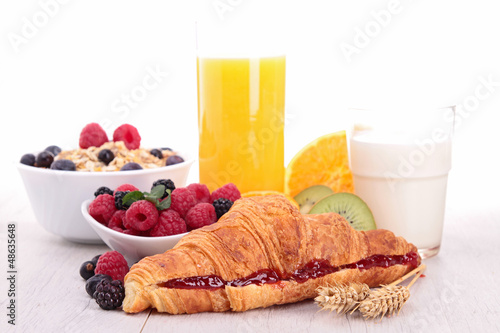 Photo: breakfast with croissant, juice and fruits breakfast with croissant, juice and fruits