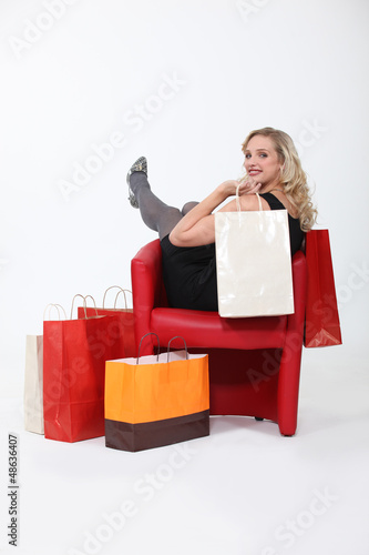 Photo: A woman with plenty of shopping bags. A woman with plenty of shopping bags.