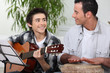 Father and son playing music