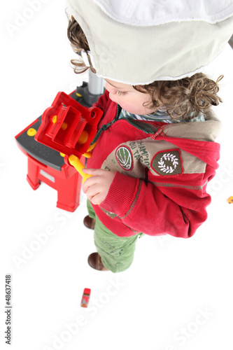 Photo: Child pretending to be a tradesperson Child pretending to be a tradesperson