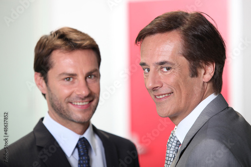 Photo: Two businessmen smiling Two businessmen smiling