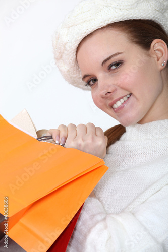 Photo: Woman hugging her shopping bags Woman hugging her shopping bags