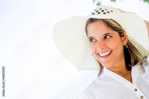 Photo: Beach woman wearing a hat Beach woman wearing a hat