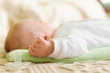 Cute newborn baby sleeping in bed
