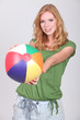 Teenage girl with inflatable beach ball