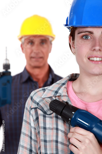 Photo: Man and woman with drills Man and woman with drills