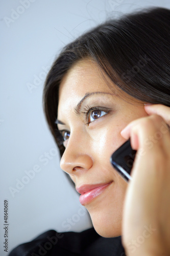 Photo: Close-up of women on her mobile Close-up of women on her mobile