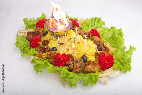 Photo: Pilaf with meat and candles Pilaf with meat and candles