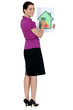 Woman with a house energy rating sign