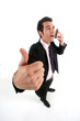 Businessman talking on phone and giving the thumb's up