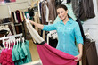 Photo: Young woman at apparel clothes shopping Young woman at apparel clothes shopping