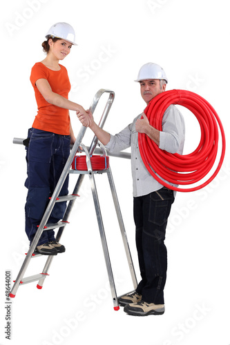 Photo: Electricians shaking hands Electricians shaking hands