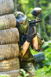 Photo: paintball player holding fire paintball player holding fire