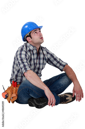 Photo: Tired builder taking well earned break Tired builder taking well earned break