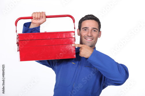 Photo: Man pointing to his toolbox Man pointing to his toolbox