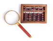 Chinese abacus and Magnifying glass,business concept