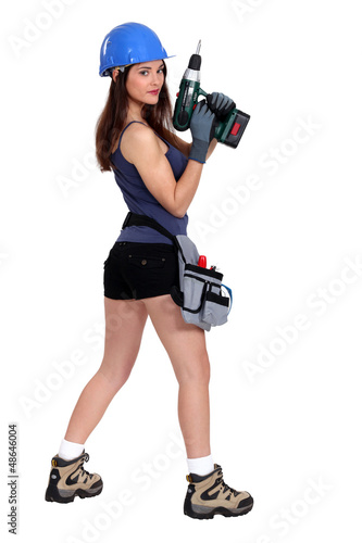 Photo: Woman holding drill Woman holding drill